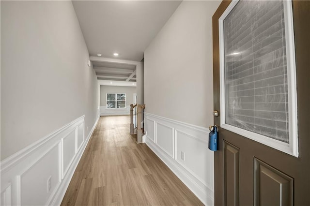 corridor with light wood-type flooring