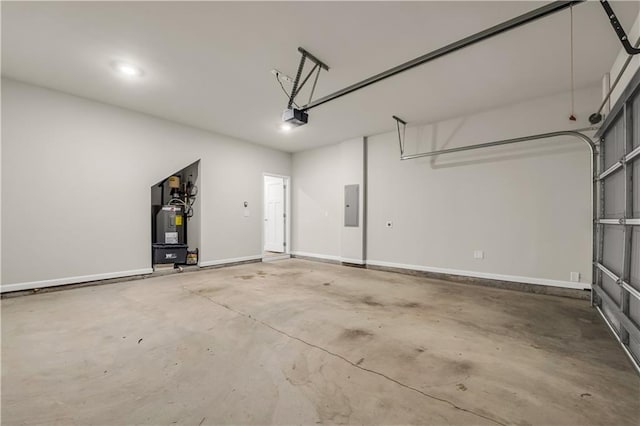 garage featuring a garage door opener, electric panel, and water heater