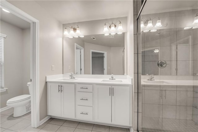 bathroom featuring vanity, tile patterned floors, toilet, and walk in shower