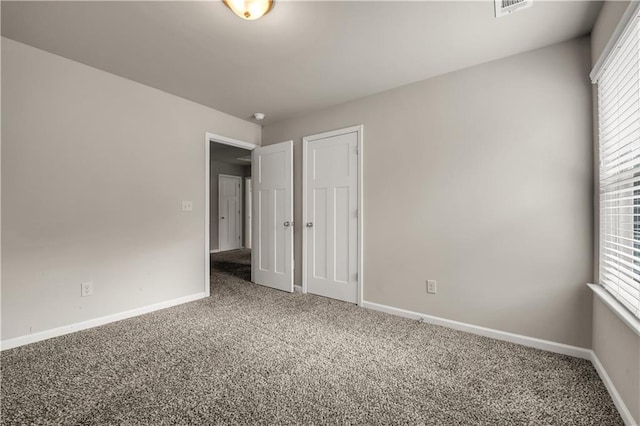 spare room featuring carpet