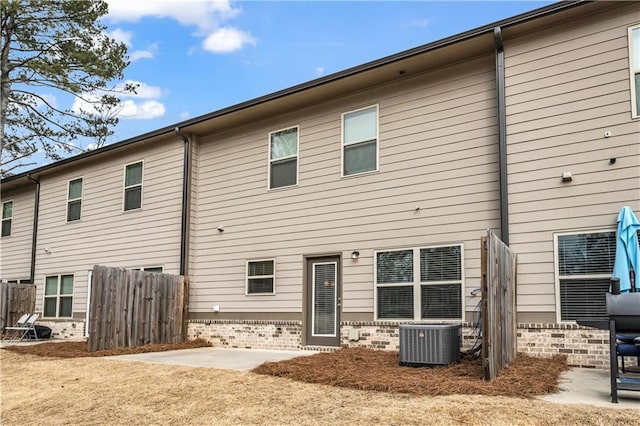 rear view of house featuring a patio and central air condition unit