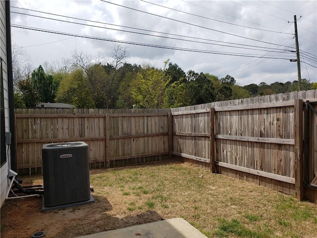 view of yard with central AC unit