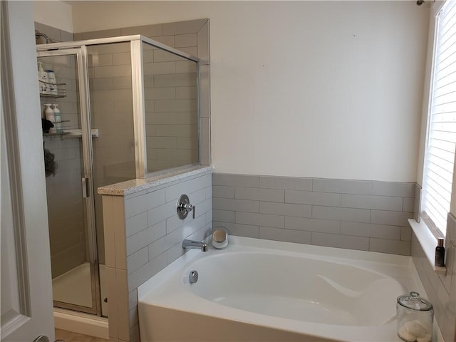 bathroom with plenty of natural light and plus walk in shower