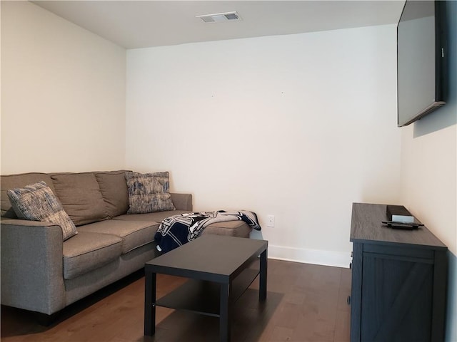 living room featuring dark hardwood / wood-style flooring