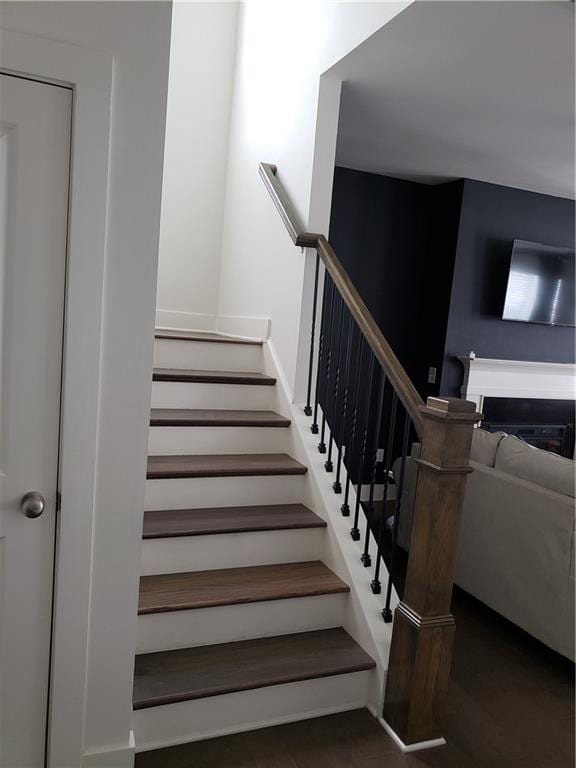 stairway featuring dark hardwood / wood-style flooring