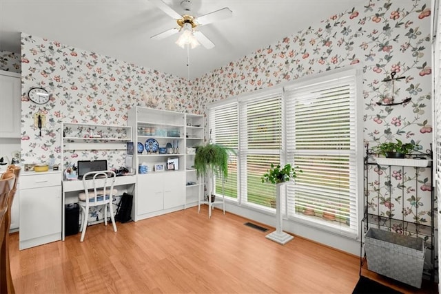 office space featuring ceiling fan and light wood-type flooring