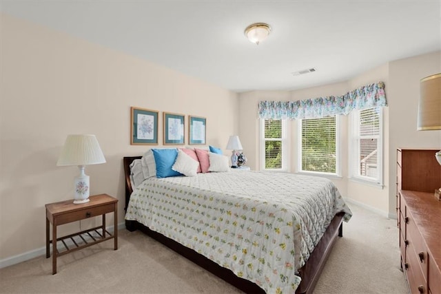 bedroom with light colored carpet