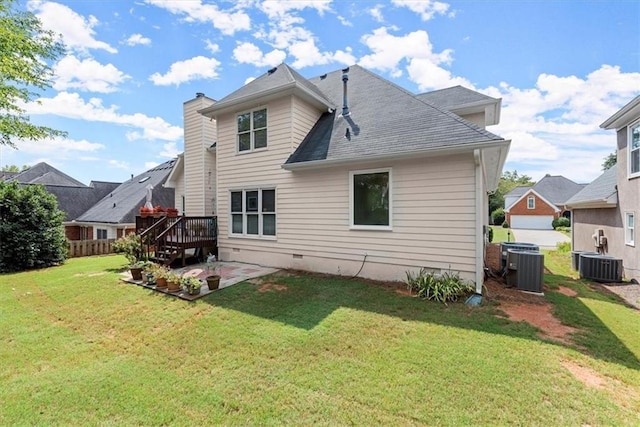 back of property featuring a lawn, a patio, central AC unit, and a wooden deck