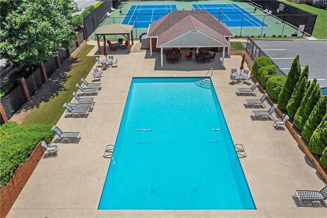 view of swimming pool featuring a gazebo and a patio