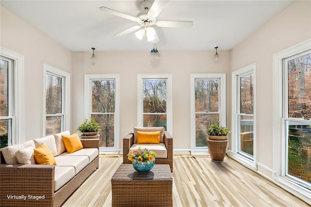 sunroom featuring plenty of natural light and ceiling fan