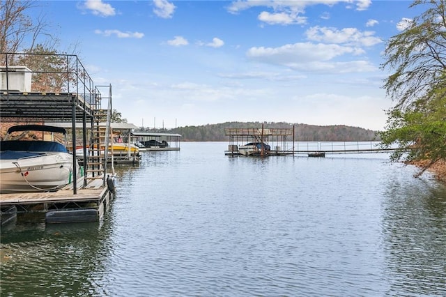 dock area featuring a water view and boat lift