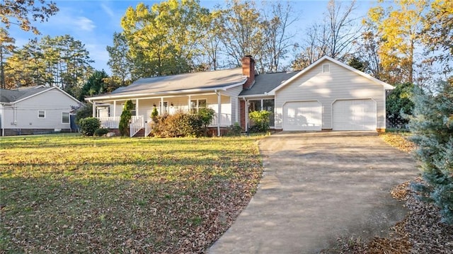 single story home with a porch, a garage, concrete driveway, a chimney, and a front yard