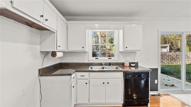 kitchen with dishwasher, crown molding, a sink, and white cabinets