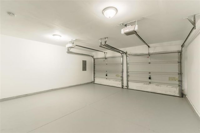 garage featuring a garage door opener and electric panel