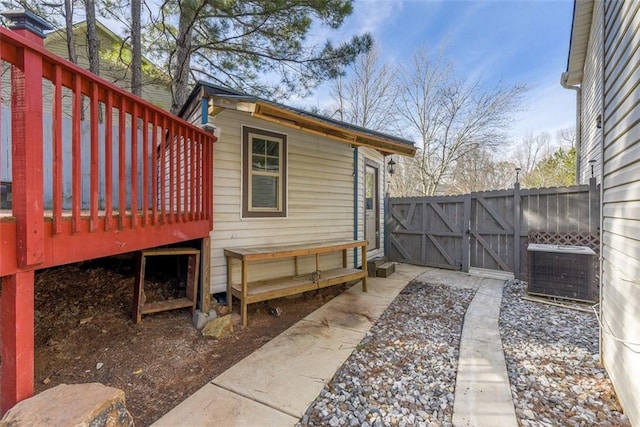 exterior space featuring cooling unit and a deck