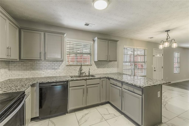 kitchen with gray cabinets, tasteful backsplash, black dishwasher, sink, and kitchen peninsula