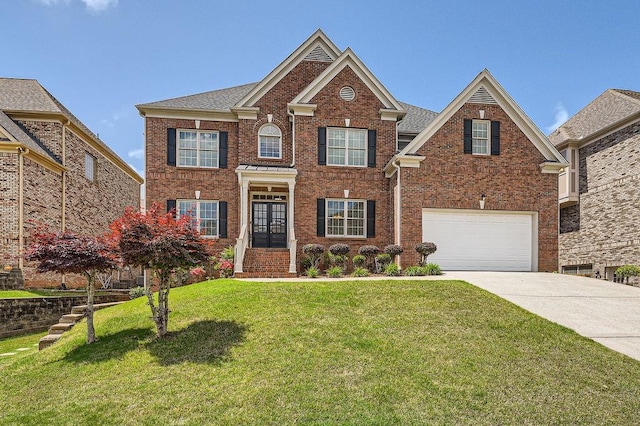 view of front of house featuring a front yard, roof with shingles, brick siding, concrete driveway, and an attached garage