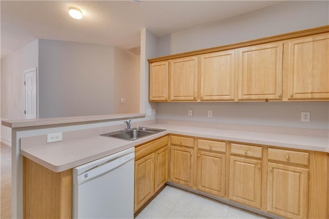 124 Camry Ln, Grayson, GA 30017 - kitchen with white dishwasher, a sink, a peninsula, light countertops, and a textured ceiling