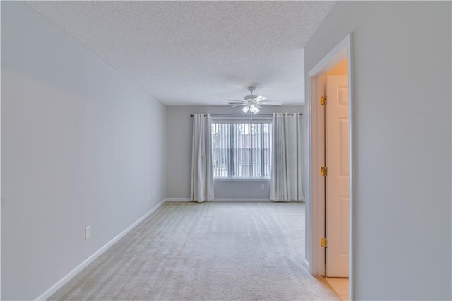 124 Camry Ln, Grayson, GA 30017 - empty room featuring light carpet, a textured ceiling, a ceiling fan, and baseboards