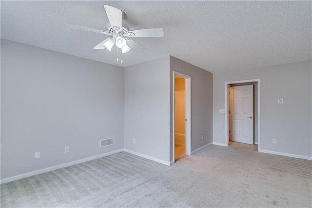 124 Camry Ln, Grayson, GA 30017 - unfurnished bedroom with carpet floors, baseboards, ceiling fan, a textured ceiling, and ensuite bath