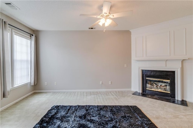 124 Camry Ln, Grayson, GA 30017 - unfurnished living room with carpet flooring, a high end fireplace, ceiling fan, a textured ceiling, and baseboards