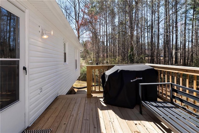 wooden terrace featuring grilling area