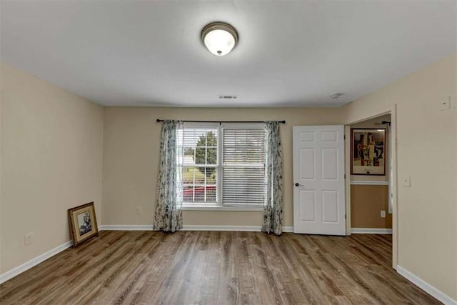 1141 Planing Mill Rd, Greensboro, GA 30642 - empty room featuring wood finished floors and baseboards