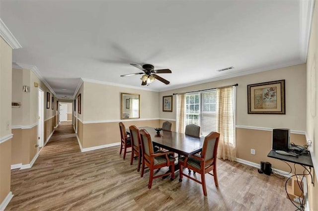 1141 Planing Mill Rd, Greensboro, GA 30642 - dining space featuring wood finished floors, baseboards, ceiling fan, and ornamental molding