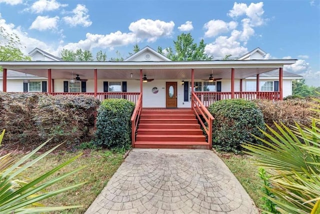 1141 Planing Mill Rd, Greensboro, GA 30642 - single story home featuring a ceiling fan, a porch, and stairway