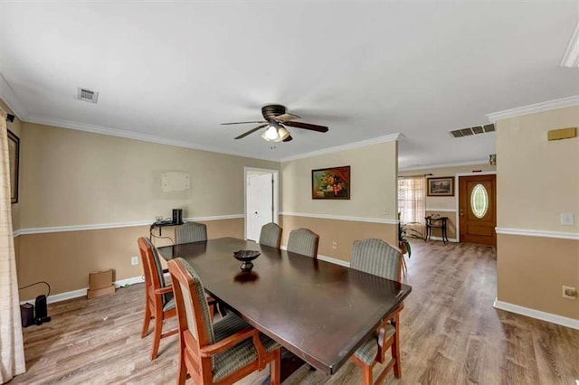 1141 Planing Mill Rd, Greensboro, GA 30642 - dining space with a ceiling fan, light wood-style flooring, baseboards, and crown molding