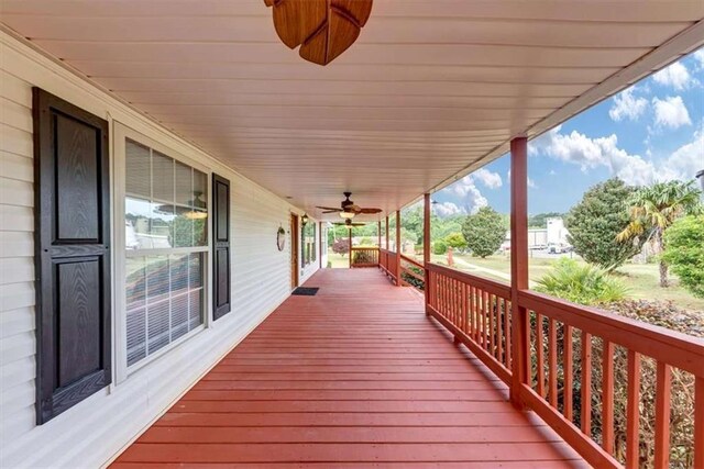 1141 Planing Mill Rd, Greensboro, GA 30642 - wooden deck featuring covered porch and ceiling fan