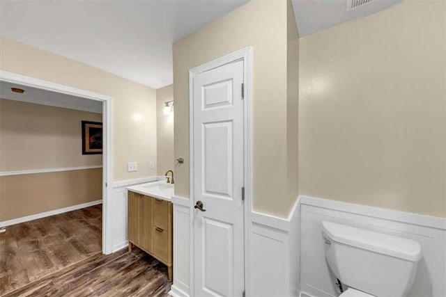 1141 Planing Mill Rd, Greensboro, GA 30642 - bathroom featuring toilet, wood finished floors, and vanity