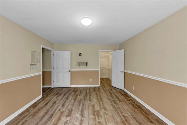 1141 Planing Mill Rd, Greensboro, GA 30642 - empty room with wood finished floors and baseboards