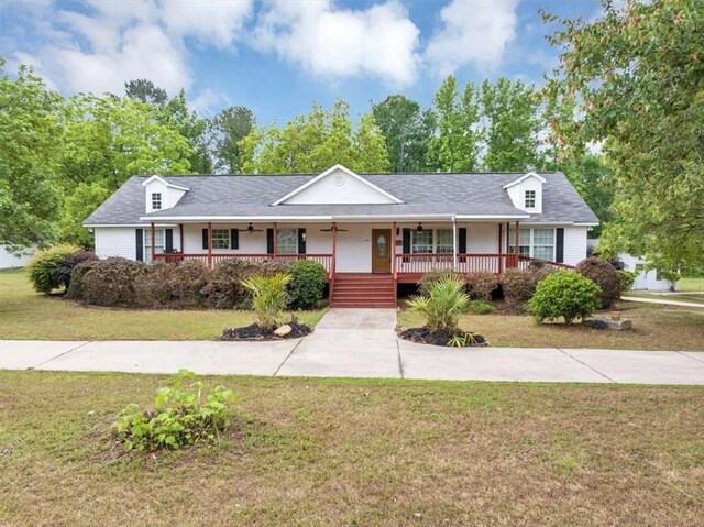 1141 Planing Mill Rd, Greensboro, GA 30642 - single story home with a porch and a front yard
