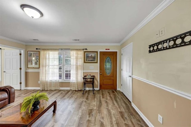 1141 Planing Mill Rd, Greensboro, GA 30642 - entryway with wood finished floors, baseboards, and crown molding