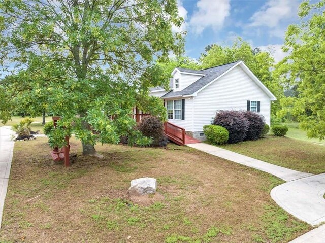1141 Planing Mill Rd, Greensboro, GA 30642 - view of side of home featuring crawl space and a yard