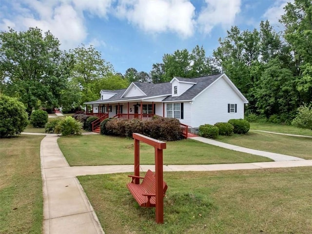 1141 Planing Mill Rd, Greensboro, GA 30642 - view of front facade featuring a porch, a front yard, and roof with shingles