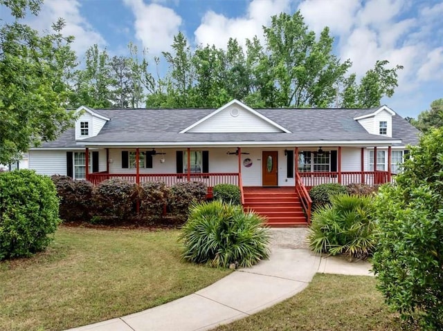 1141 Planing Mill Rd, Greensboro, GA 30642 - view of front of house featuring covered porch, a front yard, and roof with shingles