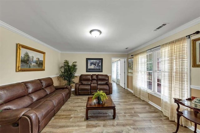 1141 Planing Mill Rd, Greensboro, GA 30642 - living room featuring ornamental molding, light wood-type flooring, and baseboards