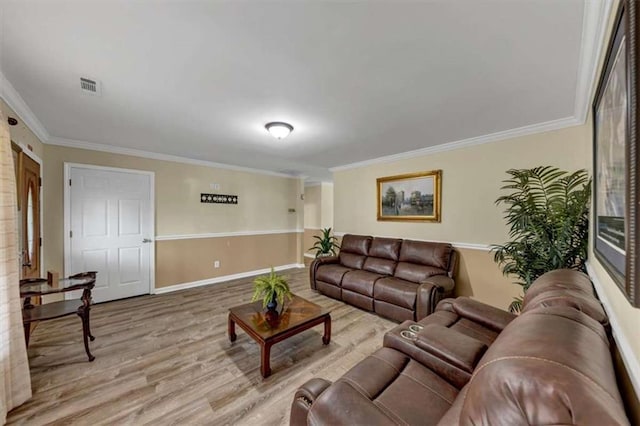 1141 Planing Mill Rd, Greensboro, GA 30642 - living room featuring ornamental molding, light wood finished floors, and baseboards