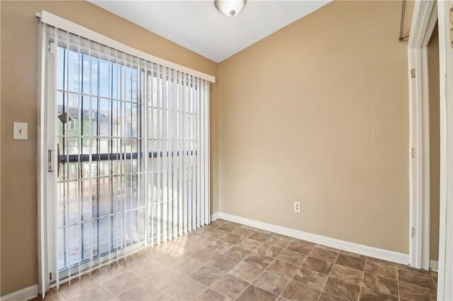 spare room with lofted ceiling