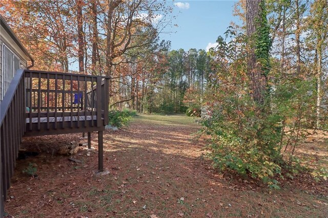 view of yard featuring a wooden deck