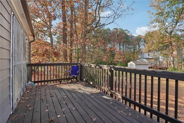 wooden deck featuring an outbuilding