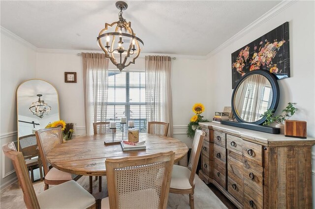 carpeted dining room featuring a notable chandelier and ornamental molding