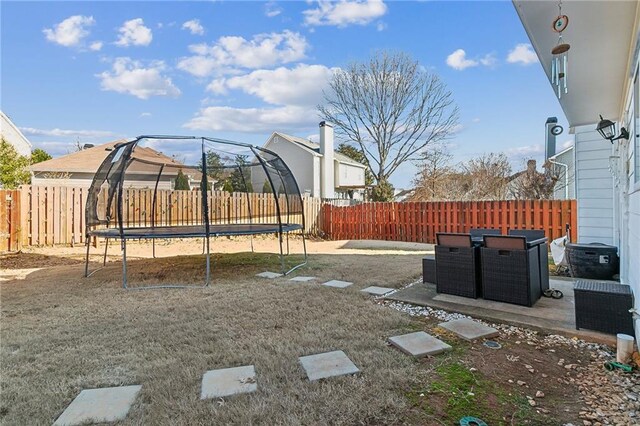 view of yard featuring a trampoline