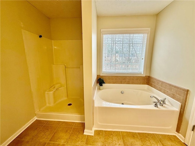 bathroom with tile patterned floors and independent shower and bath