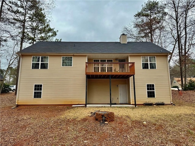 back of house featuring a deck