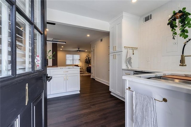 4282 Roswell Rd NE Unit G1, Atlanta, GA 30342 - kitchen featuring dark wood-type flooring, white cabinetry, recessed lighting, a sink, and a peninsula