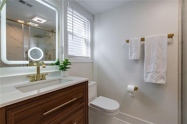 4282 Roswell Rd NE Unit G1, Atlanta, GA 30342 - bathroom featuring toilet, a marble finish shower, and vanity
