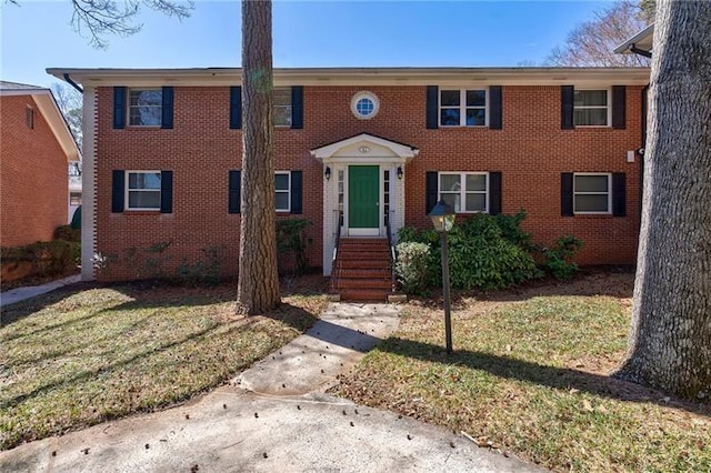 4282 Roswell Rd NE Unit G1, Atlanta, GA 30342 - view of front of home with a front lawn and brick siding